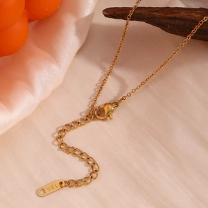 Detailed view of the 18K gold plated necklace clasp and extender chain with engraving