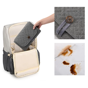 Portable waterproof diaper changing mat in grey quilted fabric with stylish wood button