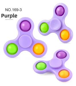 Detailed view of purple fidget spinner with three colorful pop-it silicone bubbles