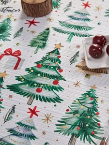 Close-up of Christmas tablecloth showing detailed festive prints on polyester fabric