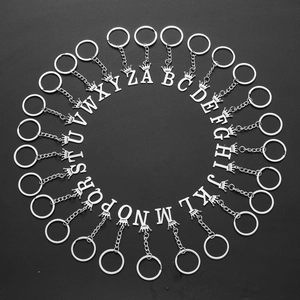 Set of 26 silver stainless steel alphabet keychains with crown charms and rings