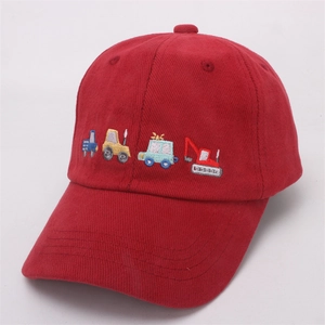 Detail of red corduroy kids baseball cap with colorful construction vehicle embroidery