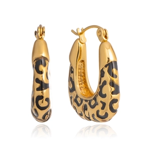 Detail of U-shaped gold earrings with black leopard print enamel and lever-back closure