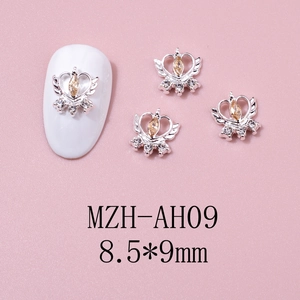 Detail view of heart crown nail charm with champagne marquise stone, size 8.5x9mm