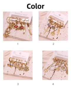 Detailed set of golden stainless steel earrings featuring star, elephant, and cross charms