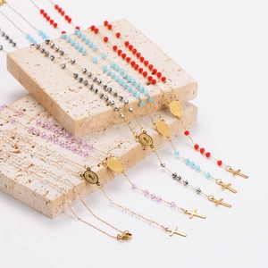 Long crystal bead necklaces with golden crucifix pendants in multiple colors for Christmas