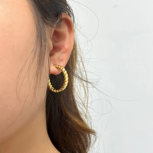 Elegant gold twisted rope hoop earrings with textured metal finish for women