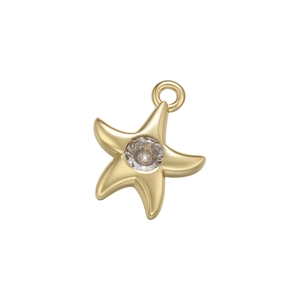 Macro shot of gold starfish pendant with a center micro-set zircon and sparkling finish