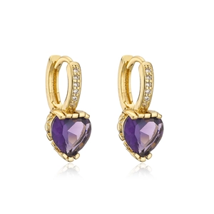 Close-up of gold plated earrings with purple heart crystals and cubic zirconia accents