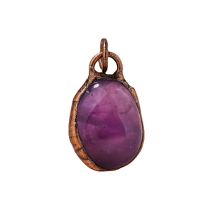 Vintage amethyst raw stone pendant with copper wrap on a minimalist white background