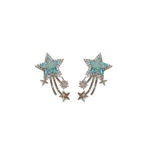 Elegant silver star earrings with blue crystals and zircon meteor tassels on white backdrop