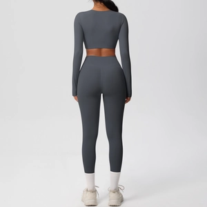 Detail of charcoal grey long sleeve crop top and high waist leggings fitness set