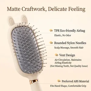 Beige air cushion hairbrush with rabbit ears and golden ring detail for scalp massage
