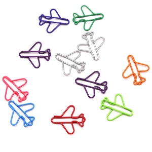 Colorful airplane-shaped paper clips in various bright metallic finishes for office use