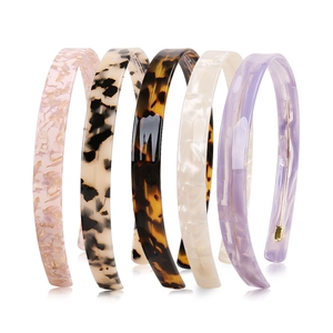Set of five 1.5cm minimalist acetate headbands in floral, leopard, and marble patterns