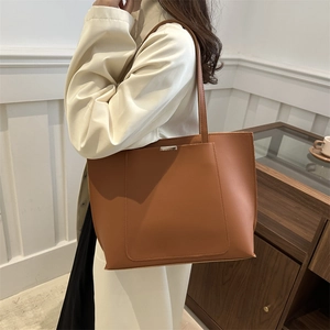 Brown large capacity tote bag with long shoulder straps and metal buckle for women