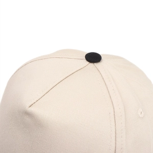 Macro shot of high-density twill fabric panels and top button on a baseball cap