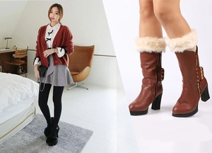 Close-up of brown PU leather ankle boots with cream faux fur trim and side buckle detail