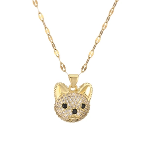 Close-up of golden dog pendant with sparkling crystal inlay on a flat link chain
