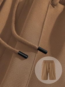 Detail of brown quick-dry fabric with pineapple texture and adjustable drawstring tie