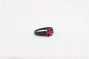 Close-up of black titanium steel ring featuring a red embossed Iron Cross design