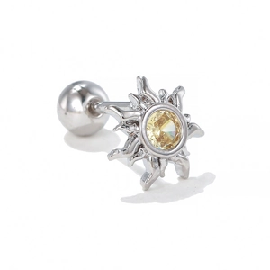 Detailed close-up of a silver sun-shaped stud earring with a yellow zircon stone