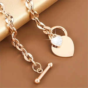Rose gold heart pendant bracelet with toggle clasp and sparkling pave zircon details