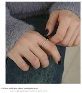 Detail of s925 silver ring with rainbow zircon gemstones worn by a fashion model
