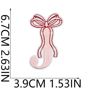 Detailed embroidery patch of pink bow letter J with measurements 6.7cm x 3.9cm