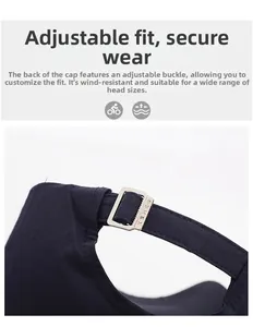 Detailed view of the adjustable metal buckle on a navy blue cotton baseball cap strap