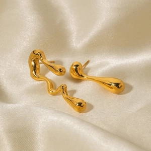 Detail of 18k gold plated asymmetric irregular water drop earrings on silk
