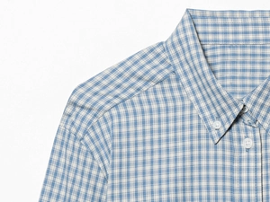 Detail view of blue and white plaid shirt showing pointed collar and quality buttons