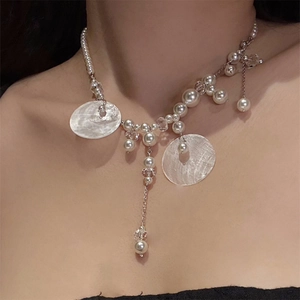 Elegant shell pearl tassel necklace with silver chain and asymmetrical layered fringe