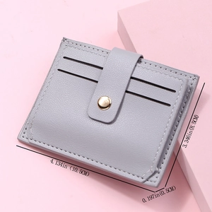 Detailed dimensions of gray minimalist card holder with slim profile and snap closure