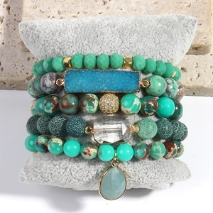 Detail view of 5-piece Bohemian stack bracelets with blue crystal and natural stone beads