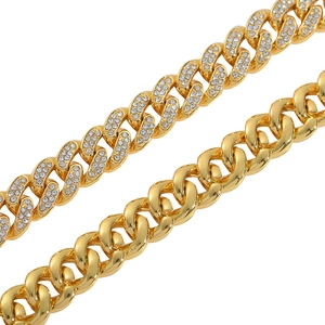 Detail of gold cuban links showing iced-out rhinestones and polished metal texture