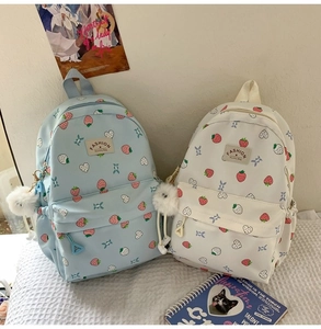 Detailed set of cute strawberry backpacks in light blue and white for students
