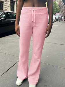 Pink drawstring joggers in velour fabric for women with a stylish street fashion look