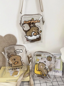 Clear PVC crossbody phone bag featuring cute cartoon capybara prints and beige straps