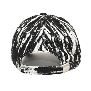 Detail view of tie-dye baseball cap back showing the silver metal adjustable buckle