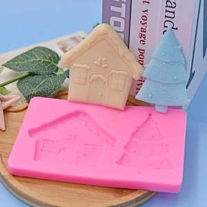 Pink silicone mold for Christmas house and tree cake toppers with finished models