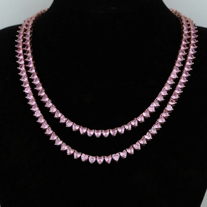 5mm pink heart zircon tennis chain in rose gold finish on black mannequin bust