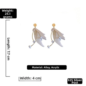 Detailed view of long white petal earrings with 925 silver pins and acrylic material