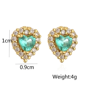 Detailed view of 18K gold plated heart stud earrings with teal stone and size markings