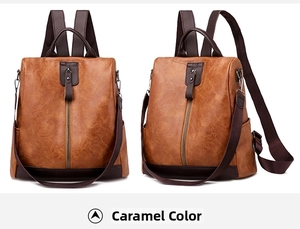 Detail of caramel PU leather backpack featuring vertical metal zippers and soft texture