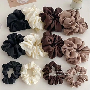 Set of 12 silk satin scrunchies in four earthy tones and three sizes for hair styling