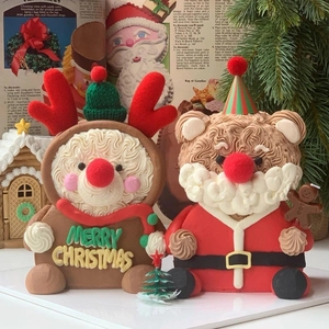 Creative Christmas cake toppers featuring Santa and Reindeer with Merry Christmas text