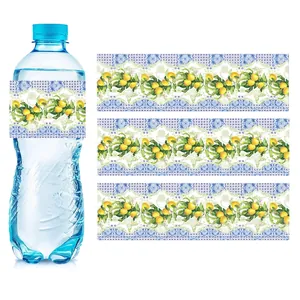 Detail of vintage lemon and Mediterranean blue tile stickers on a clear water bottle