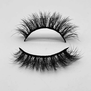 Close-up of thick curly black faux mink eyelashes on a clean white background
