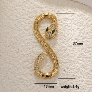 Gold plated snake pendant with green eyes and white zircons, dimensions 37x13mm